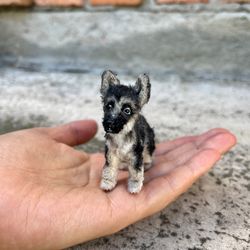 Miniature realistic German Shepherd dog