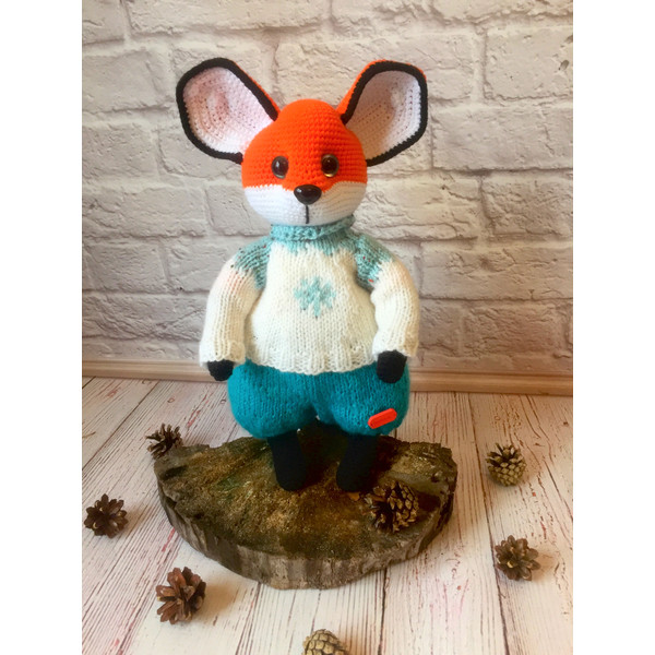fox cub on a stump