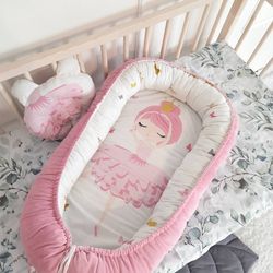 Baby  nest  for  newborn.  Pillow as  a  gift