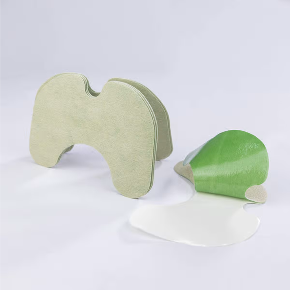Assorted herbal patches for knee pain on a clean surface
