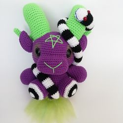 Purple baphomet with neon green curled horns and earthworm - horror movie characters