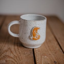 Handmade ceramic mug with fox