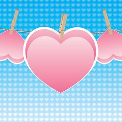 colorful heart on a rope with wooden pegs