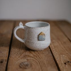 Handmade ceramic mug with little house