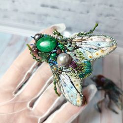 Embroidered green fly brooch with natural pearls and natural stones.