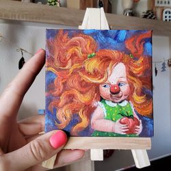 Miniature oil painting.  Focus on the good painting.  Funny clown.  Hand painting. Optimistic painting. Small painting.