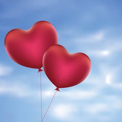 Romantic red balloons in a shape of a heart