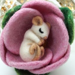 Miniature needle felted mouse sleeping in a flower