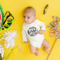 onesie-mockup-of-a-baby-surrounded-by-vacation-ornaments-m20527-r-el2.png