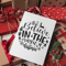christmas-card-mockup-lying-over-gifts-and-ornaments-23838.png