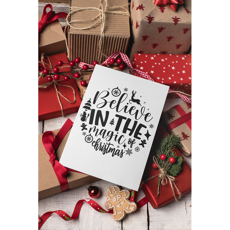 christmas-card-mockup-lying-over-gifts-and-ornaments-23838.png