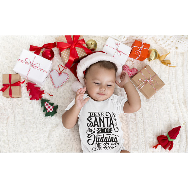 onesie-mockup-of-a-baby-surrounded-by-christmas-presents-34940-r-el2.png