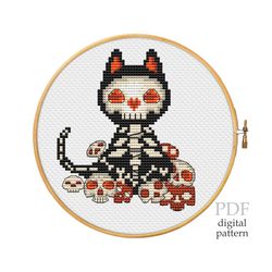 Kitten and skulls for cross stitch pattern