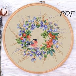 Cross stitch pattern the first snow a wreath with rosehip and blueberry