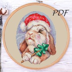 Cross stitch Rabbit with a Christmas tree cross stitch patterns design for embroidery pdf
