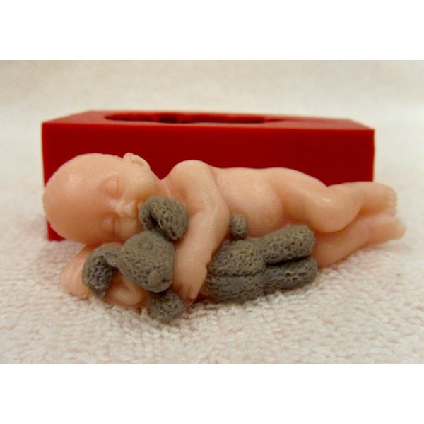Baby with bunny mold and soap