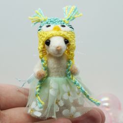 Miniature needle felted mouse in a bluea nd yellow owl hat and a tutu