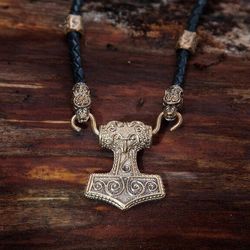 Mjolnir Thors Hammer pendant on black leather cord with runes. Gotland viking hammer replica