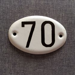 Black white apartment 70 address door number sign