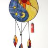 Stained glass Yin Yang dreamcatcher in blue and beige with orange sun and moon next to a red lighter on a white background.jpg