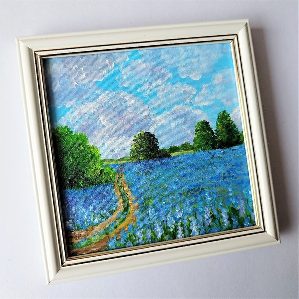 Painting-landscape-blue-wildflowers-sky-with-clouds-wall-decoration