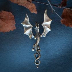 Dragon pendant with open wings on black leather cord. Gothic dragon necklace. Viking jewelry. Scandinavian mythology.