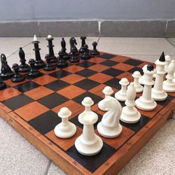 Medium size Soviet chess set: carbolite chess pieces white black & wooden folding chessboard
