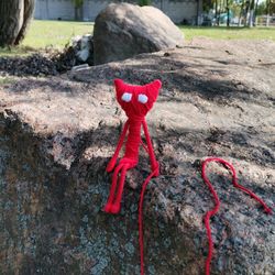 red yarny doll. poseable figurine yarny toy. hero of the game unravel. toystaty