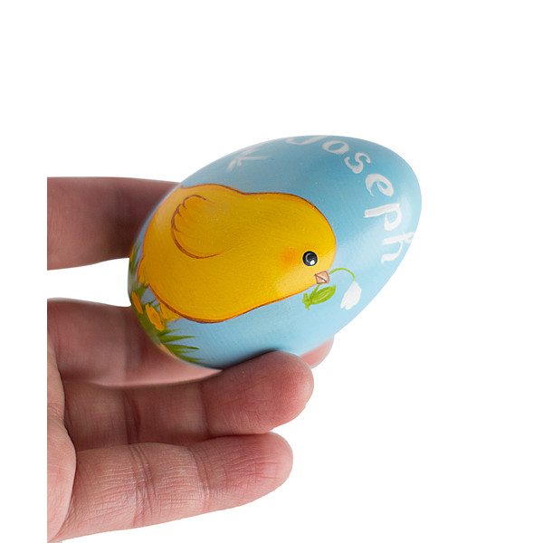 painted Easter egg with chicken and text