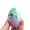 cute hatched turquoise dragon in purple shell