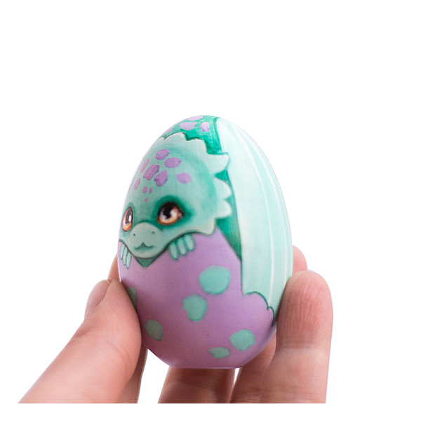 cute hatched turquoise dragon in purple shell