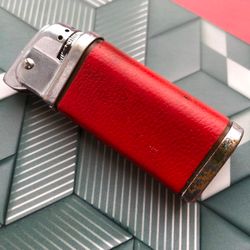 the USSR vintage lighter not tucked into the collection is red