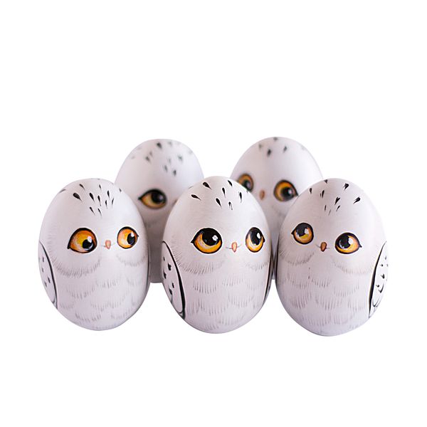 5 wooden painted eggs in the form of snowy owls