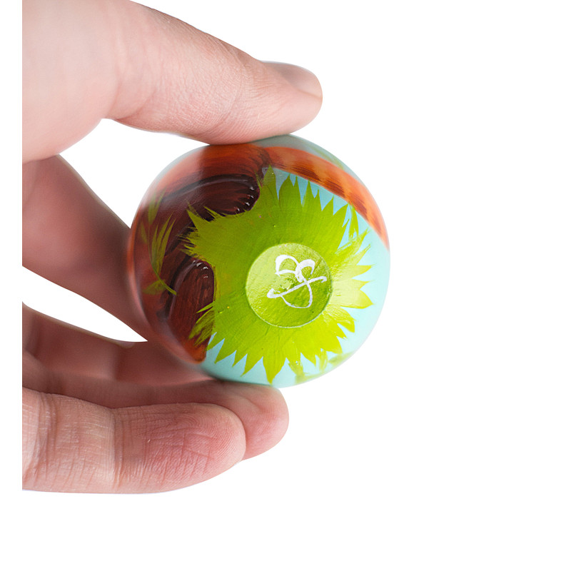 painted wooden egg with the artist's autograph on the bottom