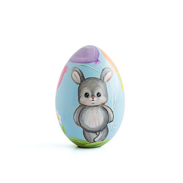 cute little bunny with balloons on painted wooden egg