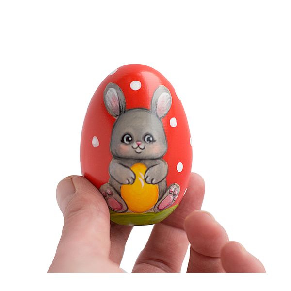 red Easter egg cute bunny with an egg in his hands