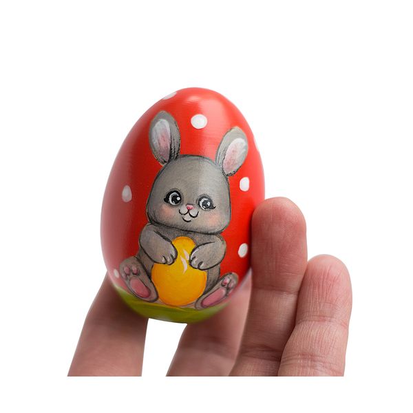 red Easter egg cute bunny with an egg in his hands