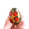 Russian Easter wooden painted egg Altai Khokhloma strawberries on a golden background