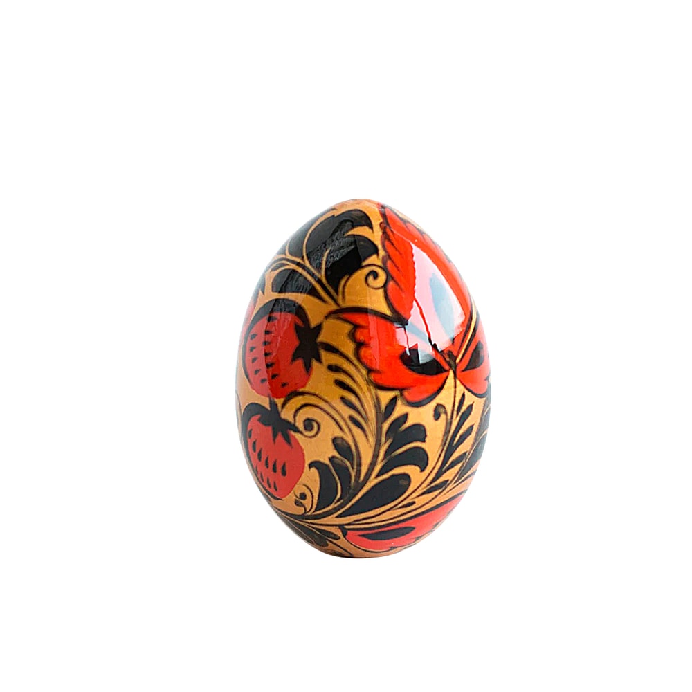 Russian Easter wooden painted egg Altai Khokhloma strawberries on a golden background