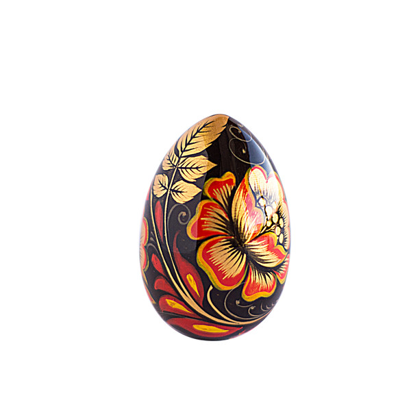 Russian painted egg Khokhloma golden flowers with red leaves on a black background