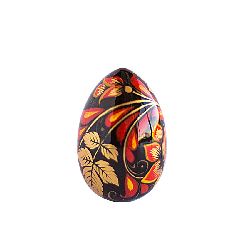 Russian painted egg Khokhloma golden flowers with red leaves on a black background