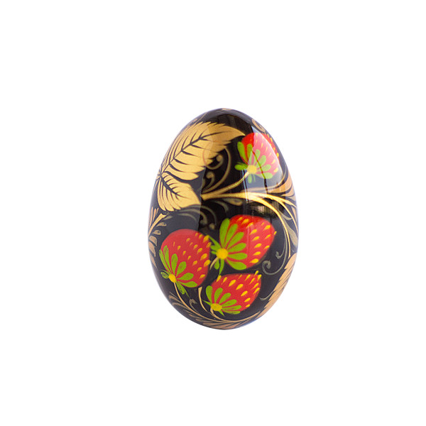 Russian wooden painted egg Khokhloma strawberry on a black background