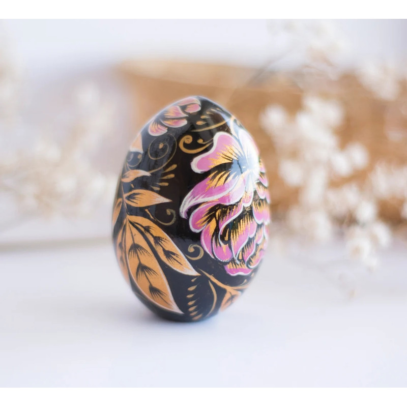 russian easter wooden egg hand painted pink peonies and golden leaves on black background