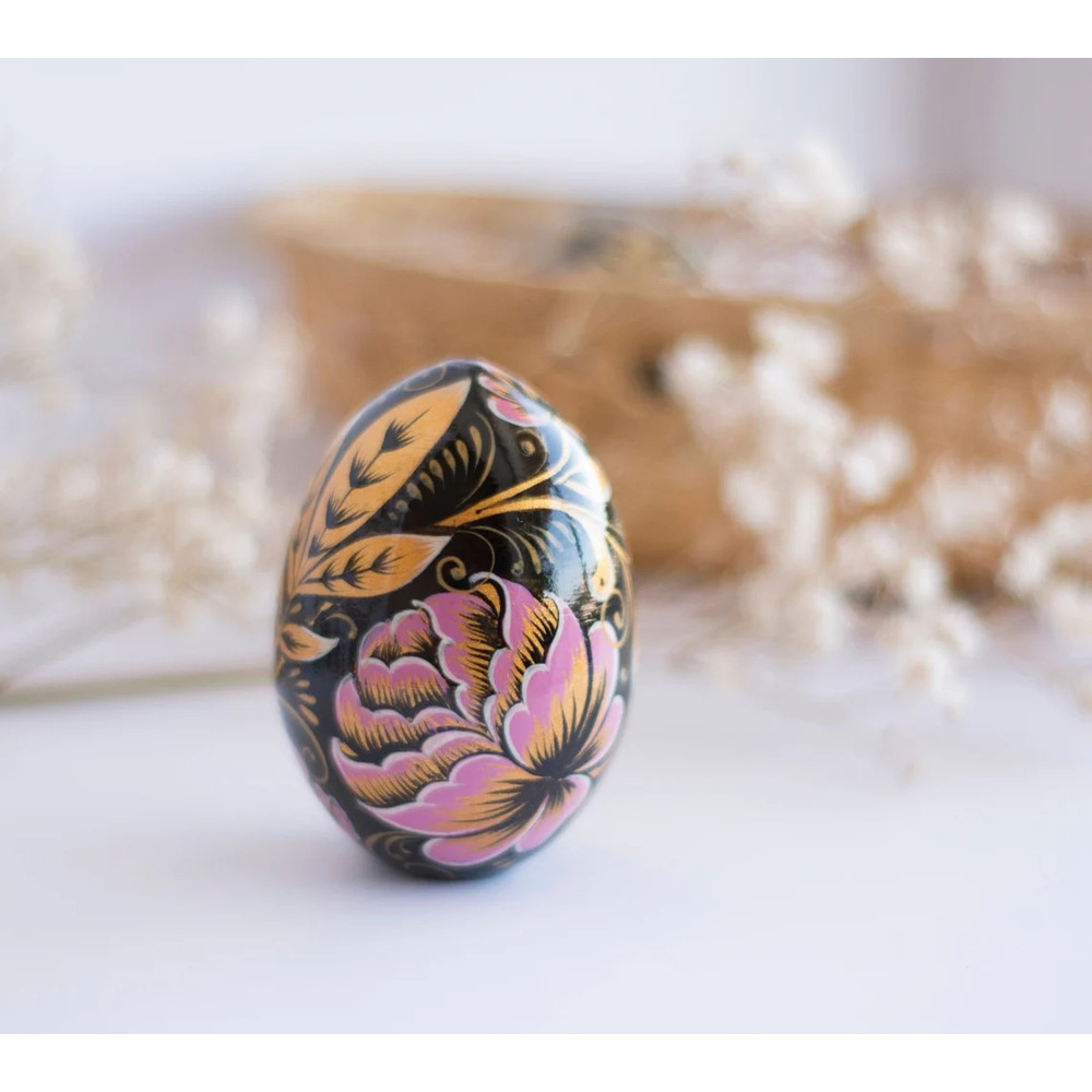russian easter wooden egg hand painted pink peonies and golden leaves on black background