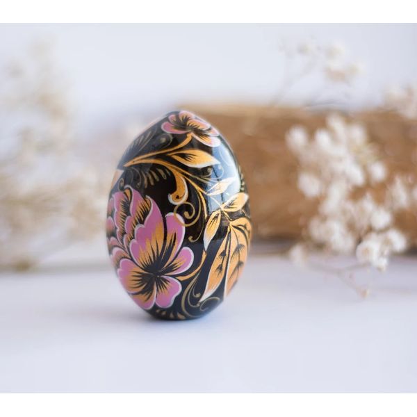 russian easter wooden egg hand painted pink peonies and golden leaves on black background
