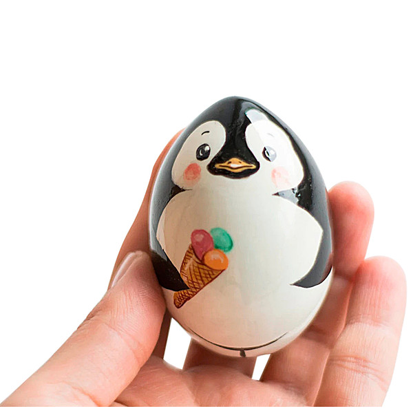 wooden painted egg cute penguin with ice cream