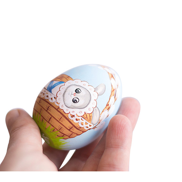 Easter wooden painted blue egg with a baby bunny
