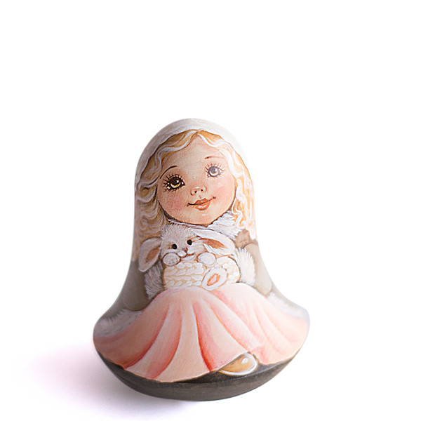 Russian wooden roly poly cute winter girl with bunny