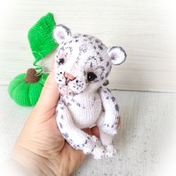 Stuffed snow leopard. Kawaii toy snow leopard. Knitted doll snow leopard. Small toy wild animal. Pocket toy snow leopard