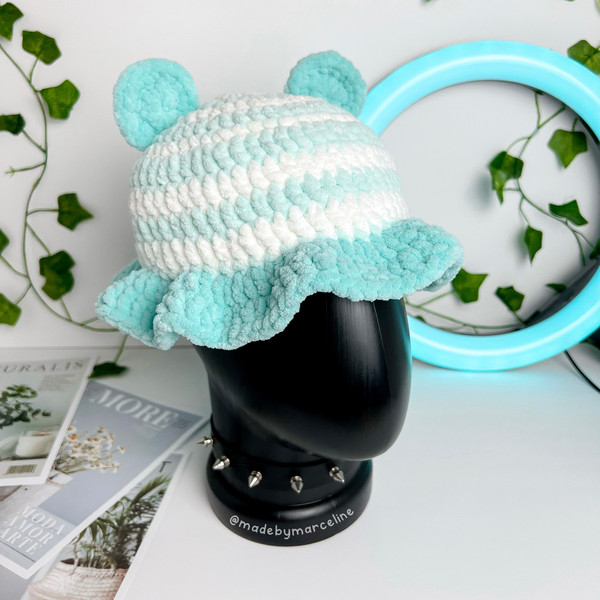 crochet with plushie yarn turquoise and white color bucket hat with bear ears on top with and curly brim 1